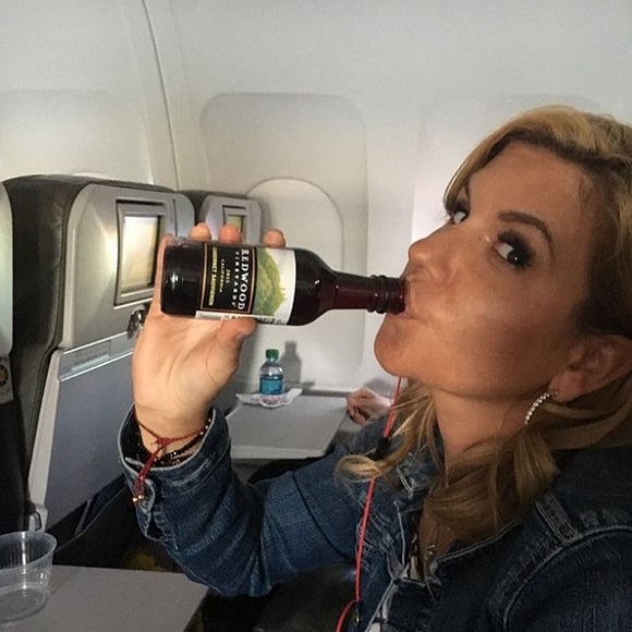 Brandi Passante drinks on the plane.